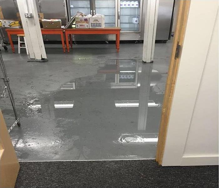 Wet flooring in a commercial kitchen area