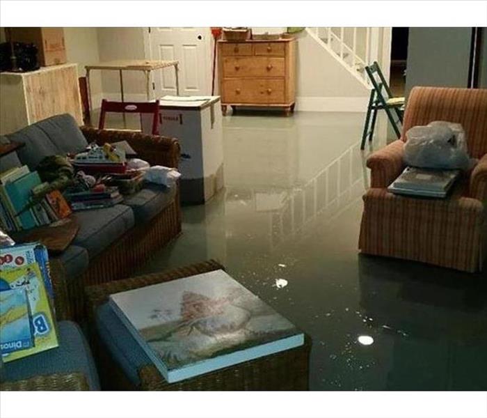 Storm water pooled about 1 inch deep on the floor of the family room of a home