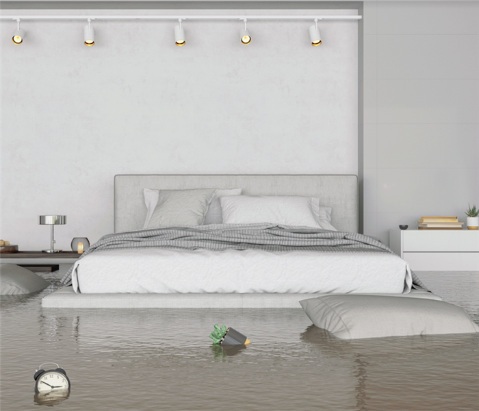 a flooded bedroom with furniture floating
