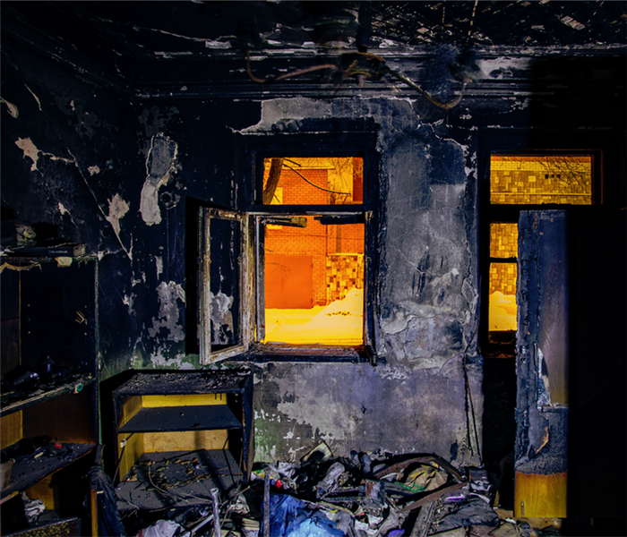 fire damaged room with burnt interior